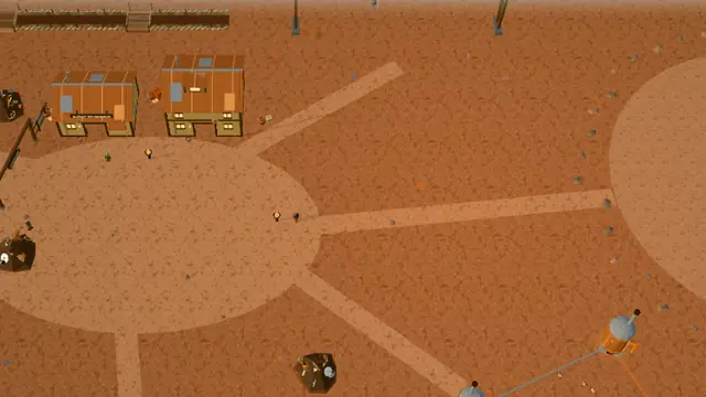 Goblintown in the game: red earth with tracks radiating from a round clearing and Nilbog workshops